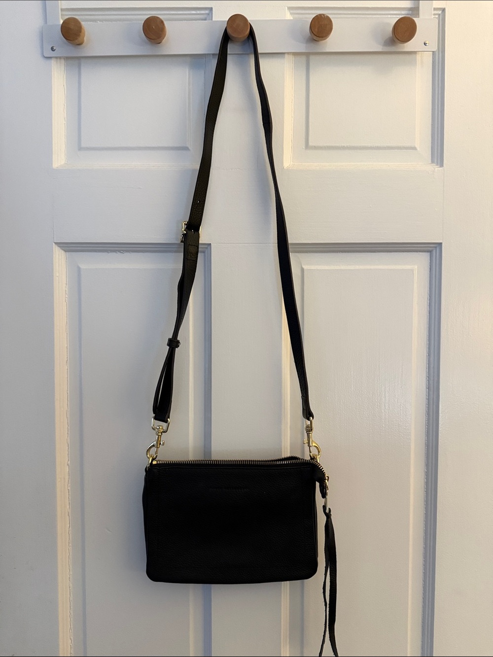 Aimee Kestenberg Black Leather Crossbody with Gold Hardware and Tassel Accent